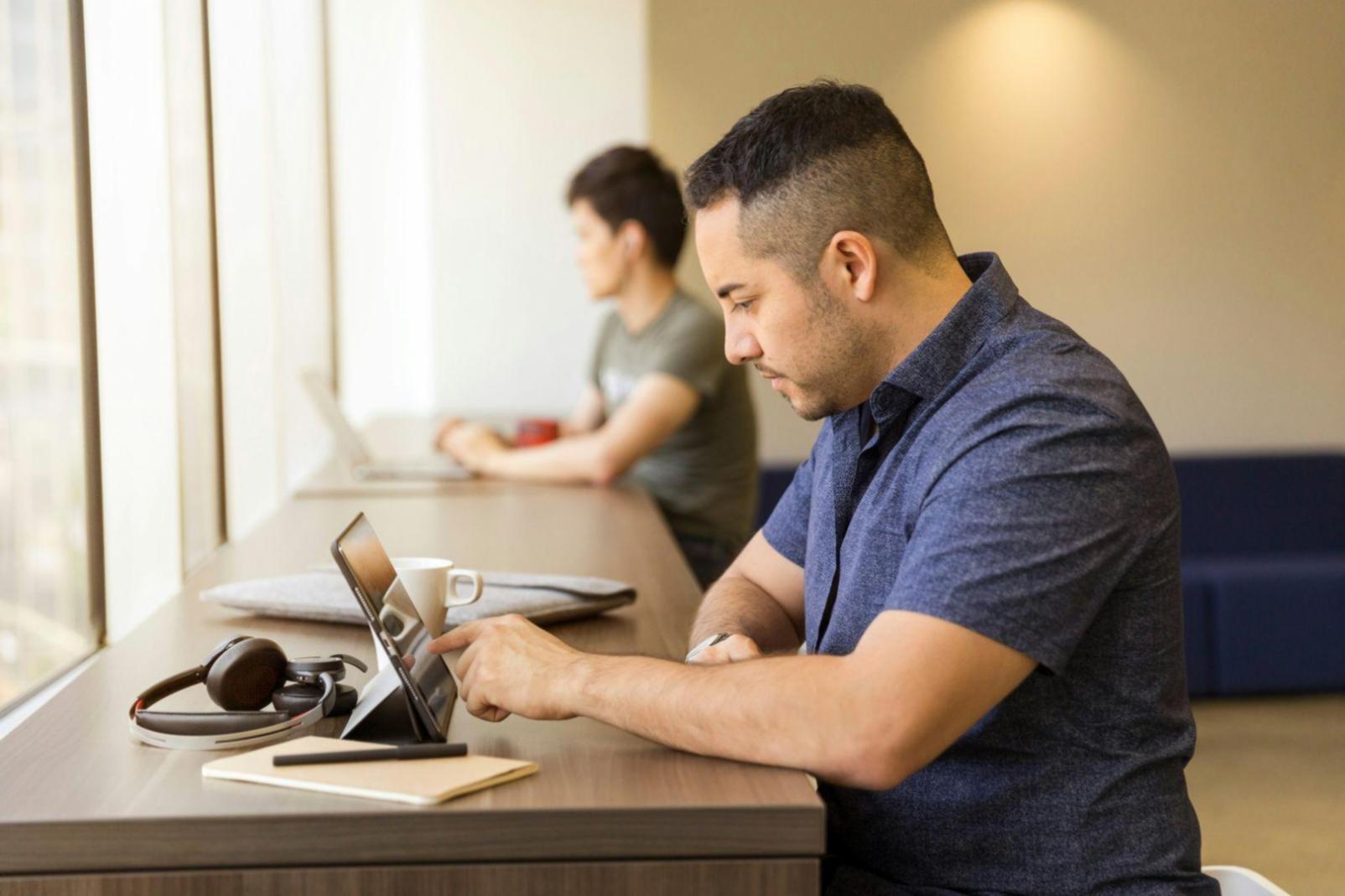 Business professionals reviewing comparative financial analysis reports